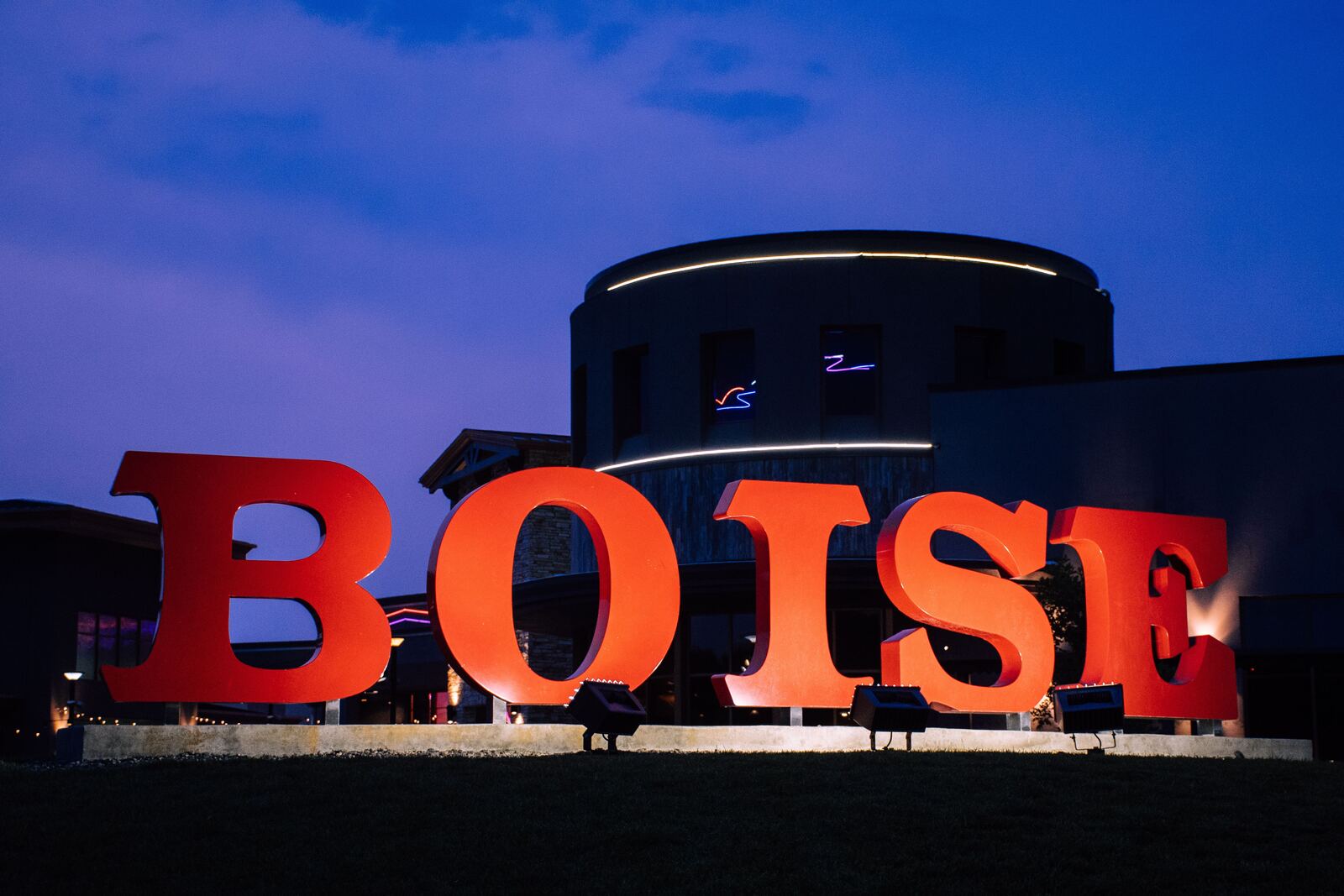 Giant red BOISE letters lit up at dusk