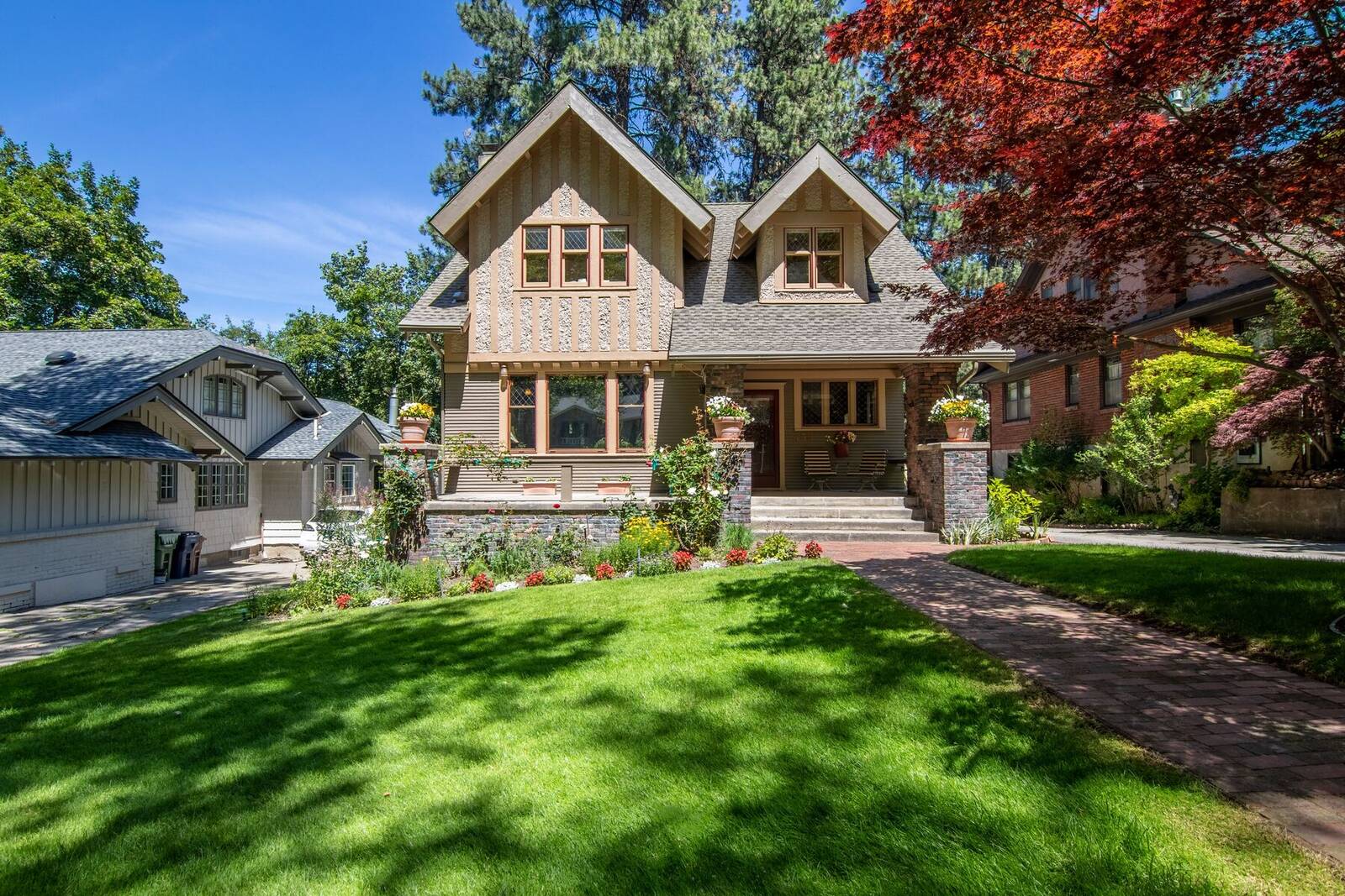 A craftsman-style home with a front lawn in a Treasure Valley neighborhood