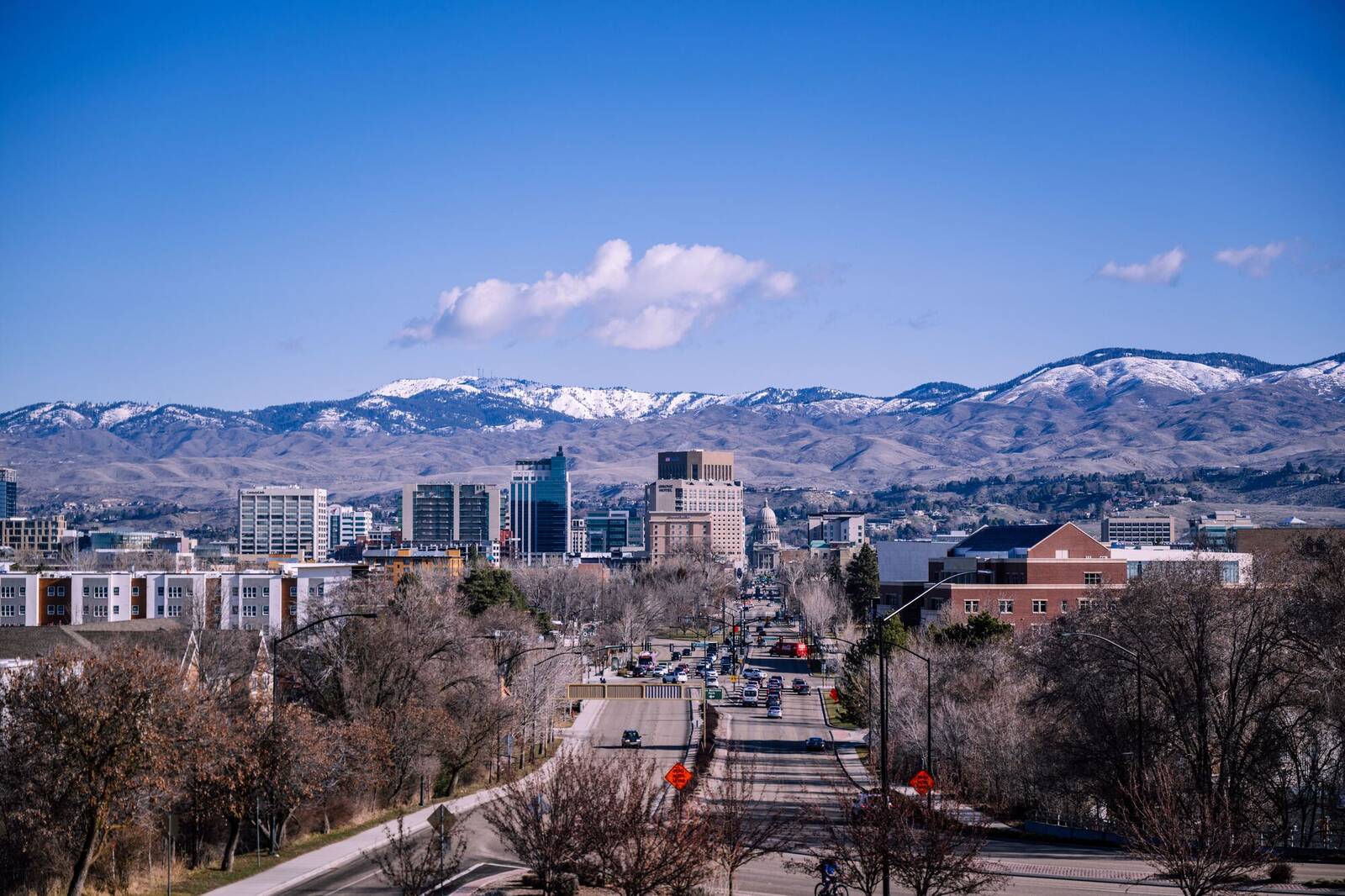 Downtown Boise and the Idaho State Capitol with the snow-dusted Boise foothills behind